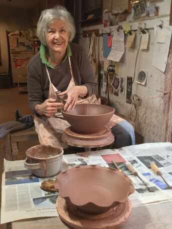 Pam Parziale in the process of throwing one of Sycamore Pottery's more popular terra cotta bowl designs